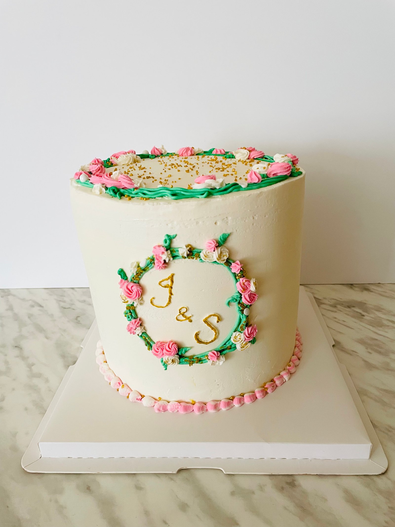 Elegant monogram wedding-style cake